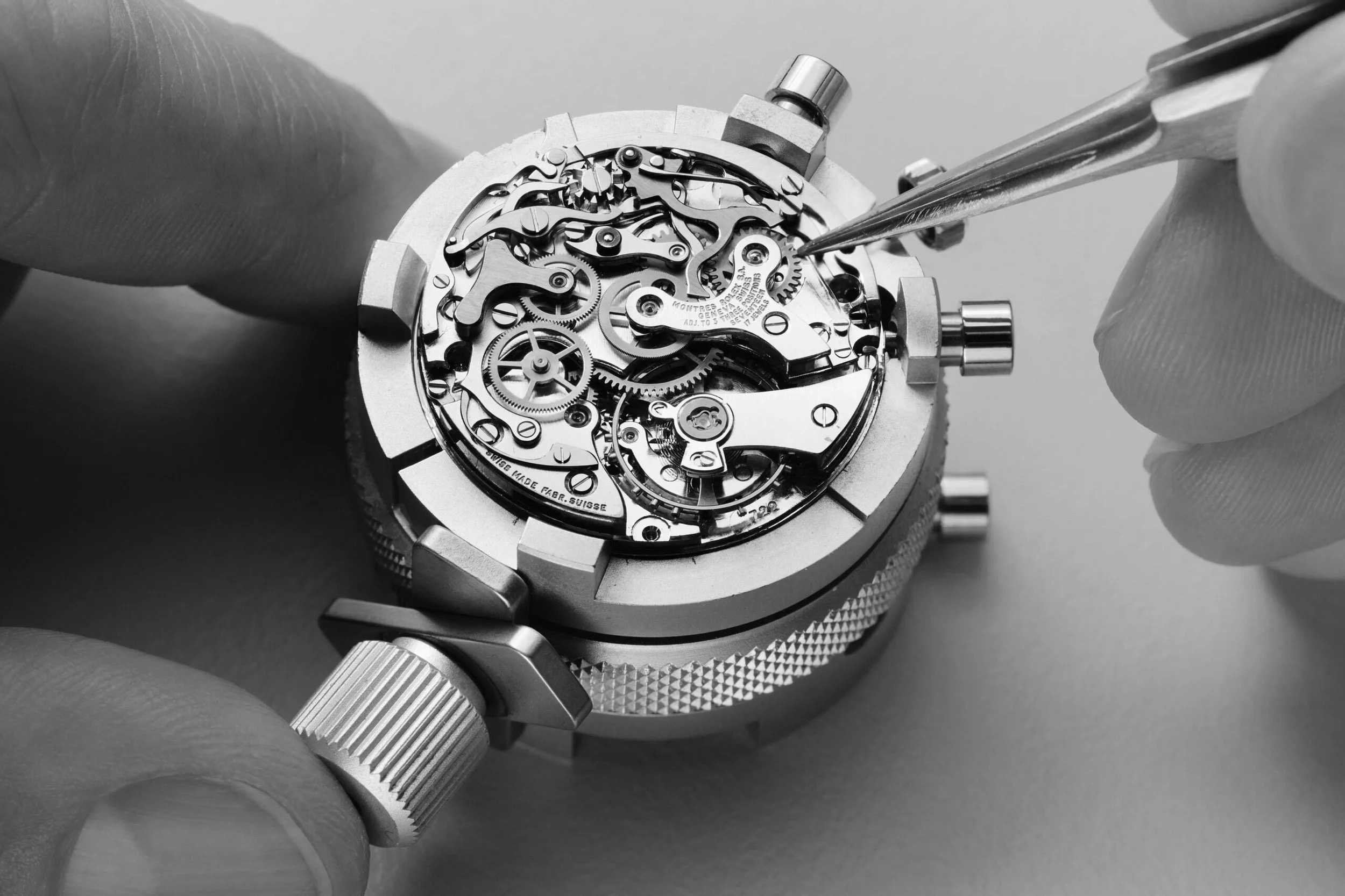 Watchmaker servicing a movement at the bench at Watch Repair Maastricht